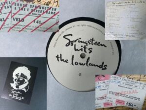 Collage met onderdelen uit de fantasy‑box Bruce Springsteen Hits the Lowlands ’85, waaronder de LP‑hoes met handgeschreven trackindeling, het fotoboek, twee veldtickets voor het concert van 12 juni 1985 in De Kuip en twee NS‑dagkaarten die op dezelfde datum zijn afgestempeld.